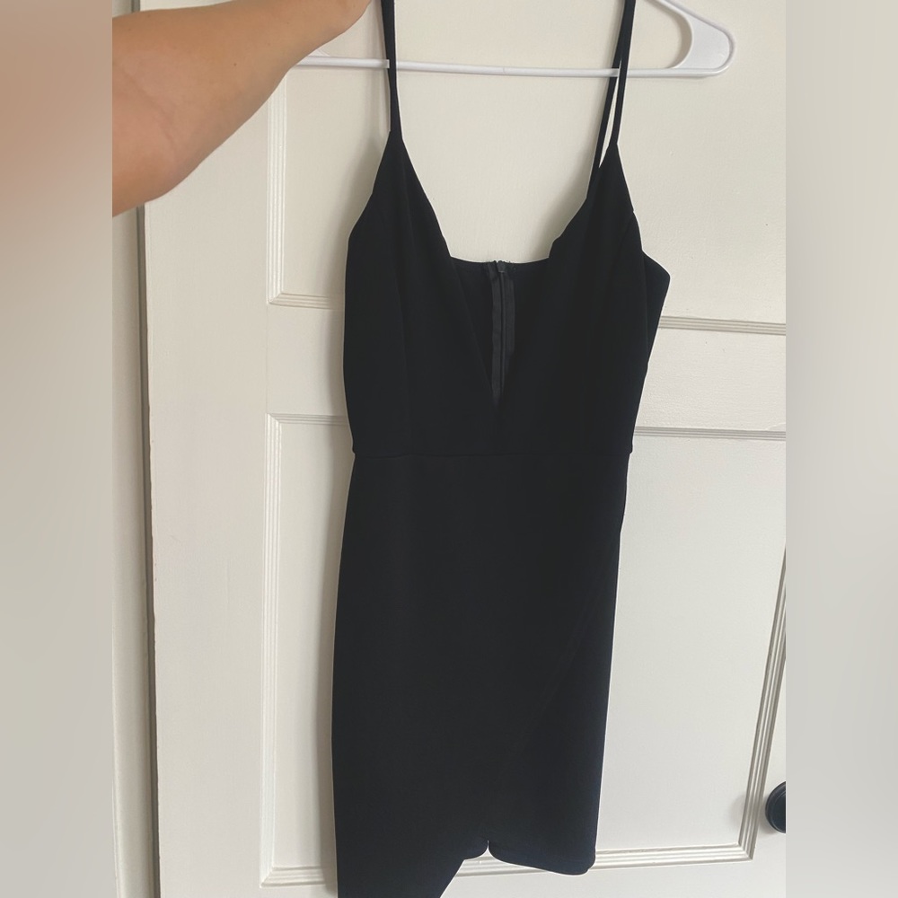 Black mini dress with structured deep v cut